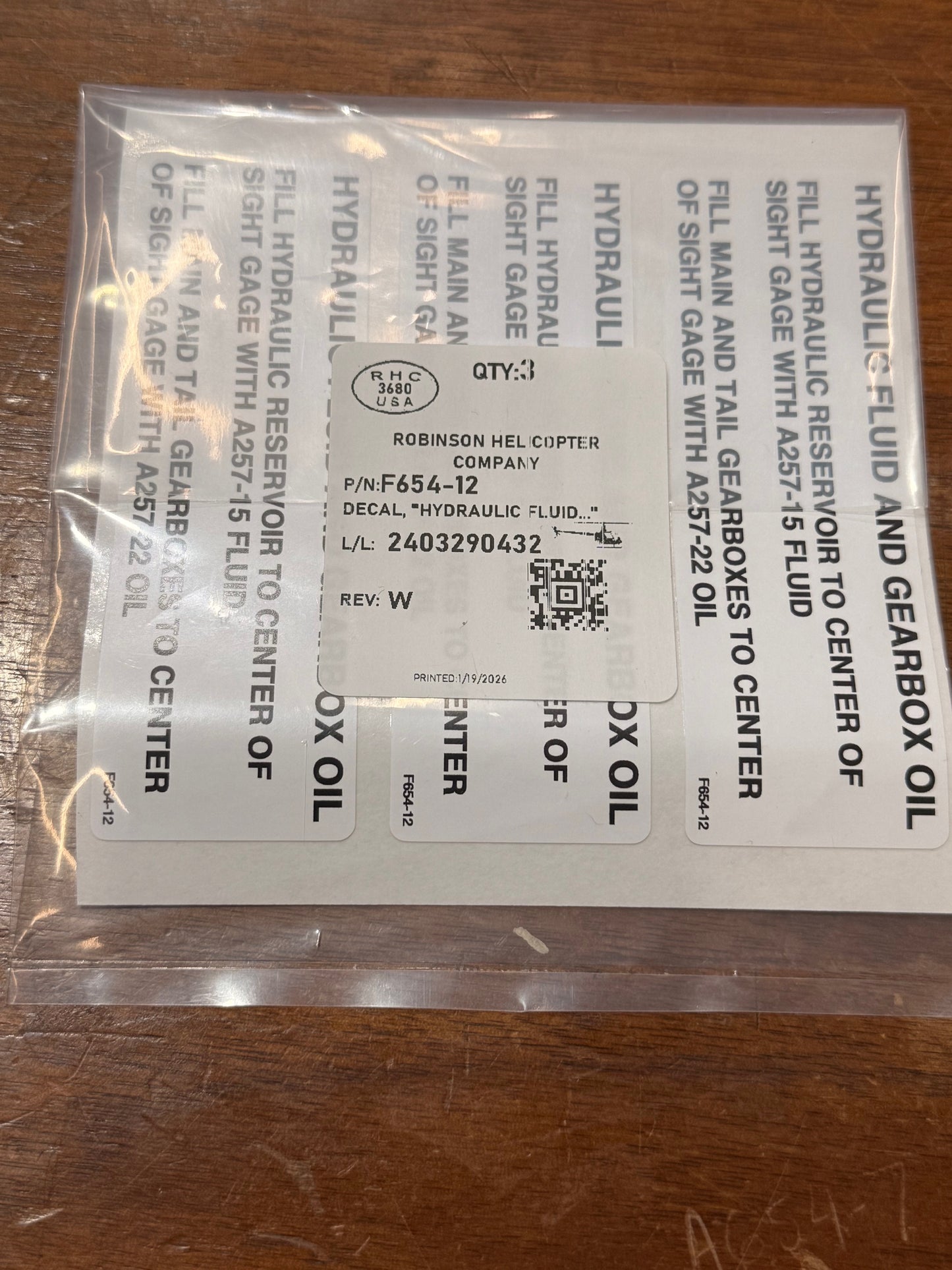 F654-12 DECAL, "HYDRAULIC FLUID"